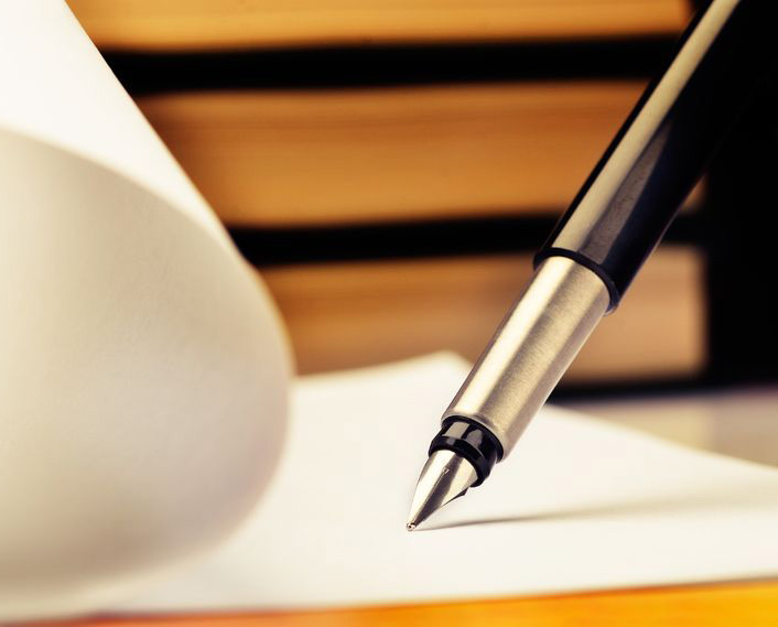 20434072 - close-up of fountain pen and book